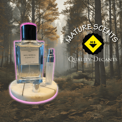 Perfume bottle labelled "Bois Imperial " by " Essential Parfums" next to a decant sample of 2ml 5ml and 10ml